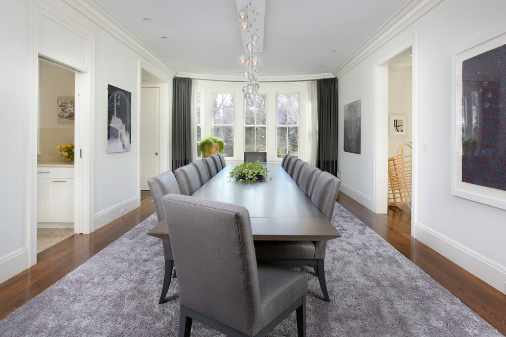 Design ideas for a transitional separate dining room in Boston with white walls.