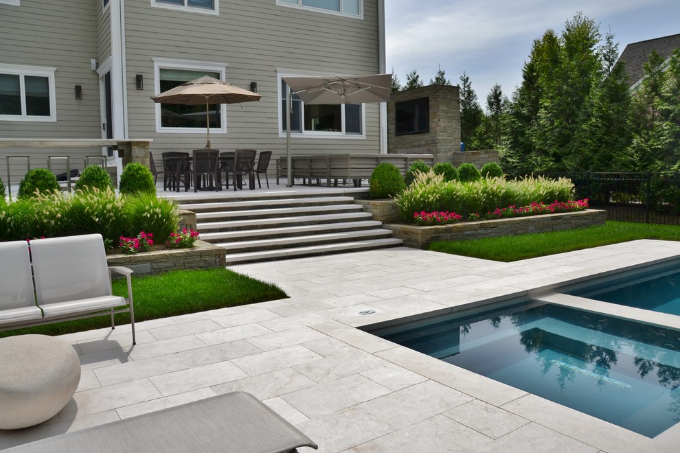 Inspiration for a large modern backyard rectangular lap pool in New York.