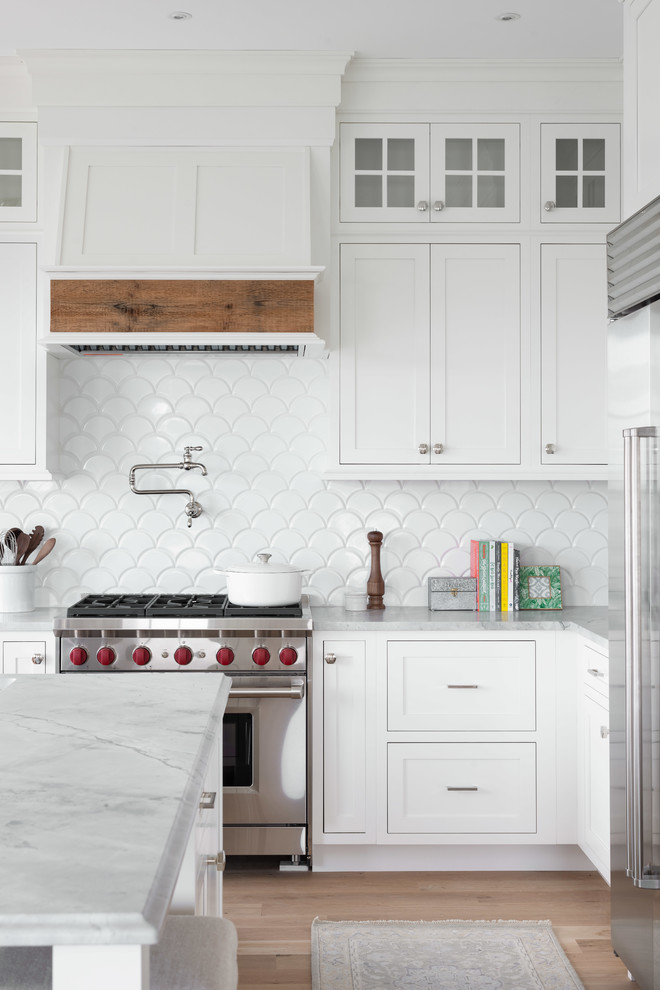 Large transitional l-shaped open concept kitchen photo with beaded inset cabinets, quartzite countertops and an island