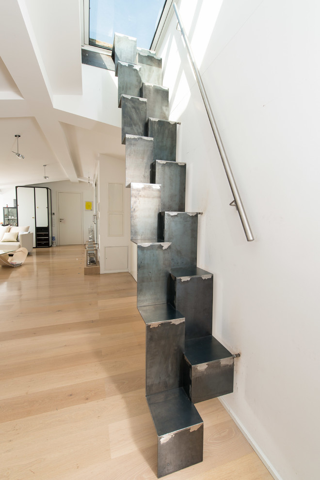 This is an example of a small industrial metal straight staircase in Munich with metal risers.