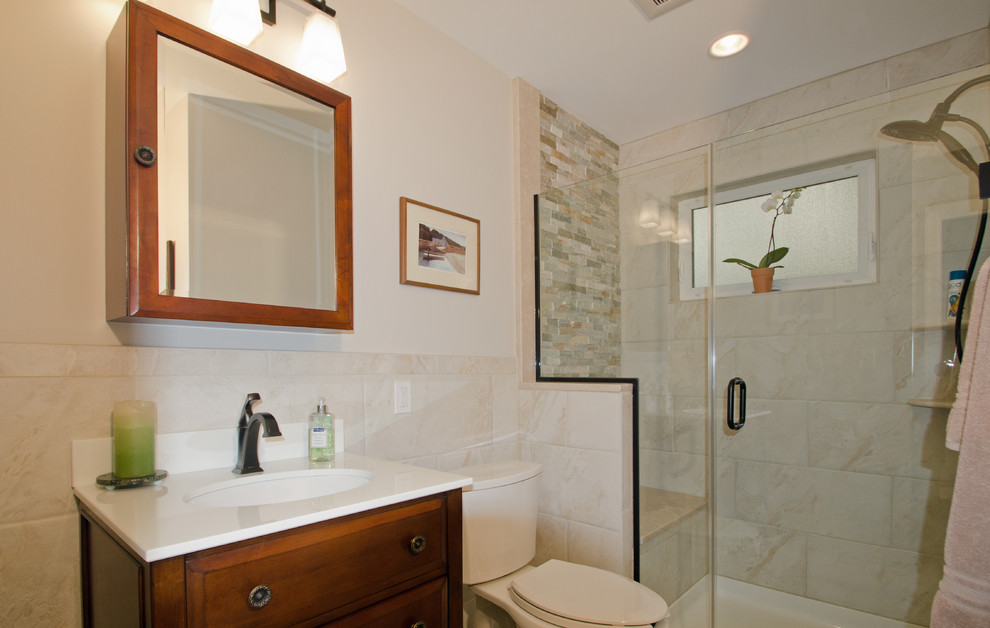 Design ideas for a small traditional 3/4 bathroom in DC Metro with a console sink, raised-panel cabinets, dark wood cabinets, engineered quartz benchtops, an alcove shower, a two-piece toilet, beige tile, ceramic tile, beige walls and ceramic floors.