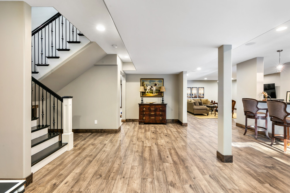 Design ideas for a traditional basement in St Louis with white walls.