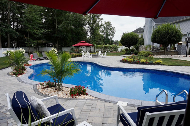 Manalapan, NJ: Freeform Paver Patio with Pool installation & Firepit contemporary-garden