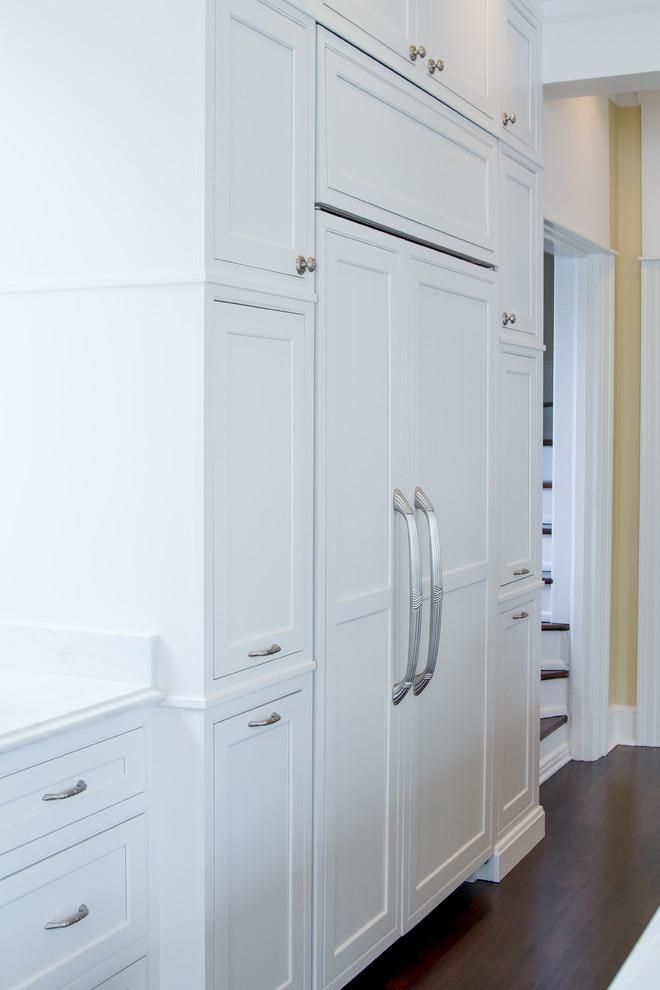 Transitional eat-in kitchen photo in New Orleans with beaded inset cabinets, white cabinets, white backsplash and stainless steel appliances