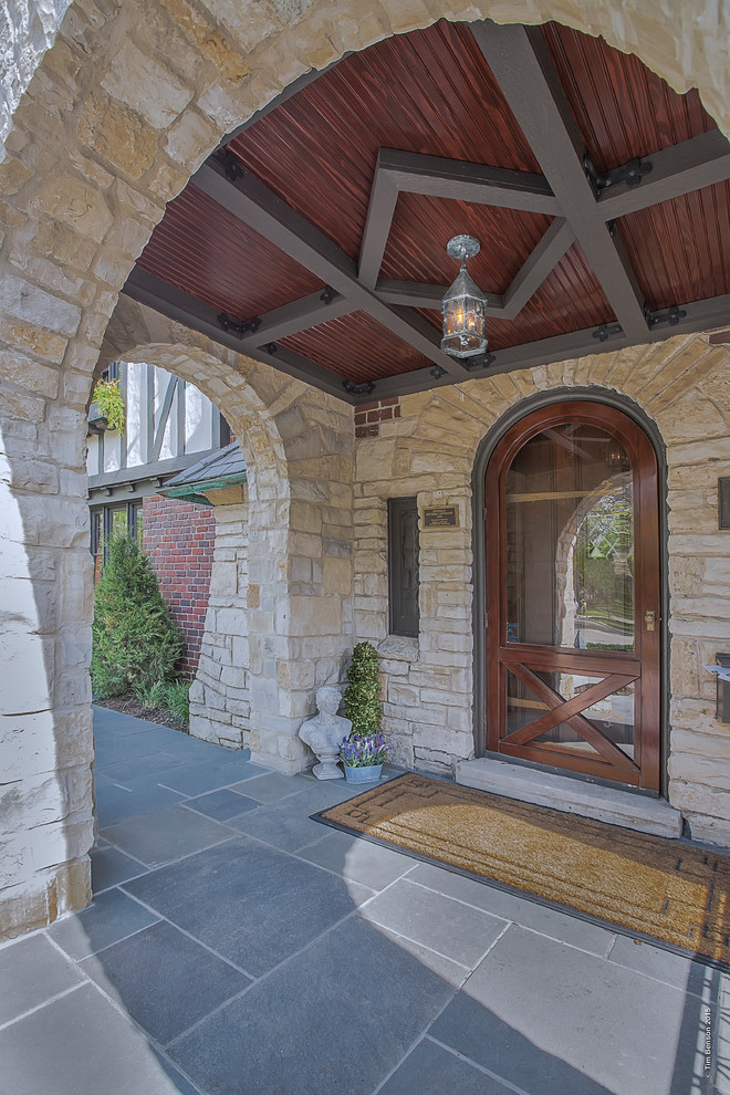 Large transitional multicolored two-story brick exterior home idea in Chicago with a hip roof