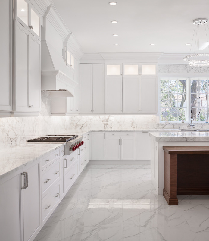Inspiration for a large transitional eat-in kitchen in New York with a farmhouse sink, shaker cabinets, white cabinets, marble benchtops, multi-coloured splashback, marble splashback, stainless steel appliances, marble floors, with island, multi-coloured floor and multi-coloured benchtop.
