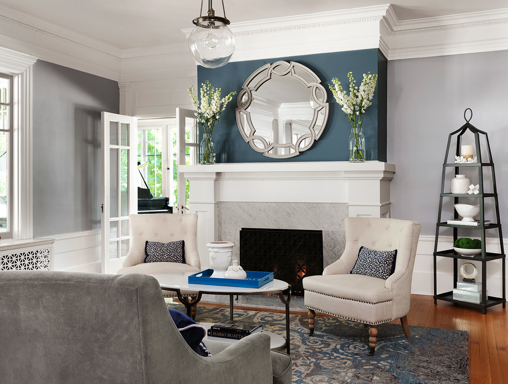 Inspiration for a large timeless formal and open concept medium tone wood floor and brown floor living room remodel in St Louis with gray walls, a standard fireplace and a stone fireplace