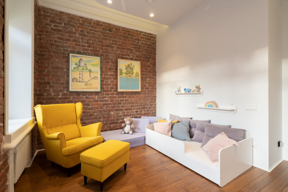 Photo of a mid-sized industrial kids' room in Saint Petersburg with white walls, medium hardwood floors, recessed and brick walls.
