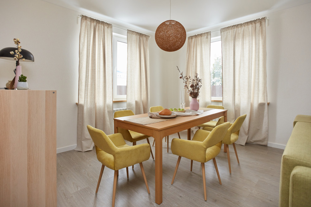 This is an example of a contemporary dining room in Moscow with grey walls, light hardwood floors and beige floor.