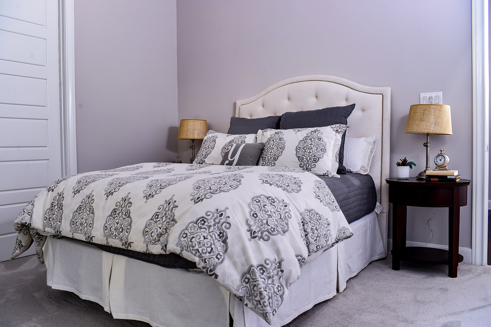Inspiration for a mid-sized transitional master bedroom in Austin with grey walls and carpet.