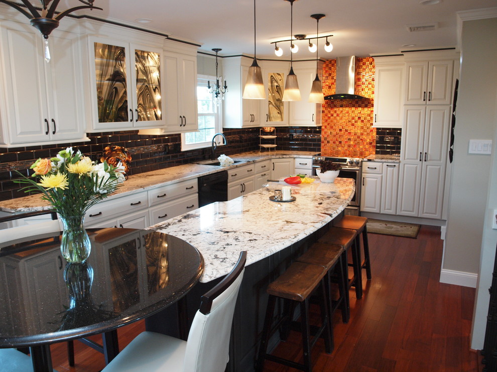 Large transitional l-shaped eat-in kitchen in Philadelphia with an undermount sink, raised-panel cabinets, white cabinets, granite benchtops, black splashback, ceramic splashback, stainless steel appliances, medium hardwood floors, with island and brown floor.