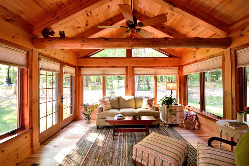 This is an example of a rustic conservatory in Cleveland.