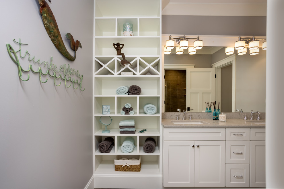 Photo of a large traditional 3/4 bathroom in Other with shaker cabinets, white cabinets, grey walls, an undermount sink, a double vanity and a built-in vanity.