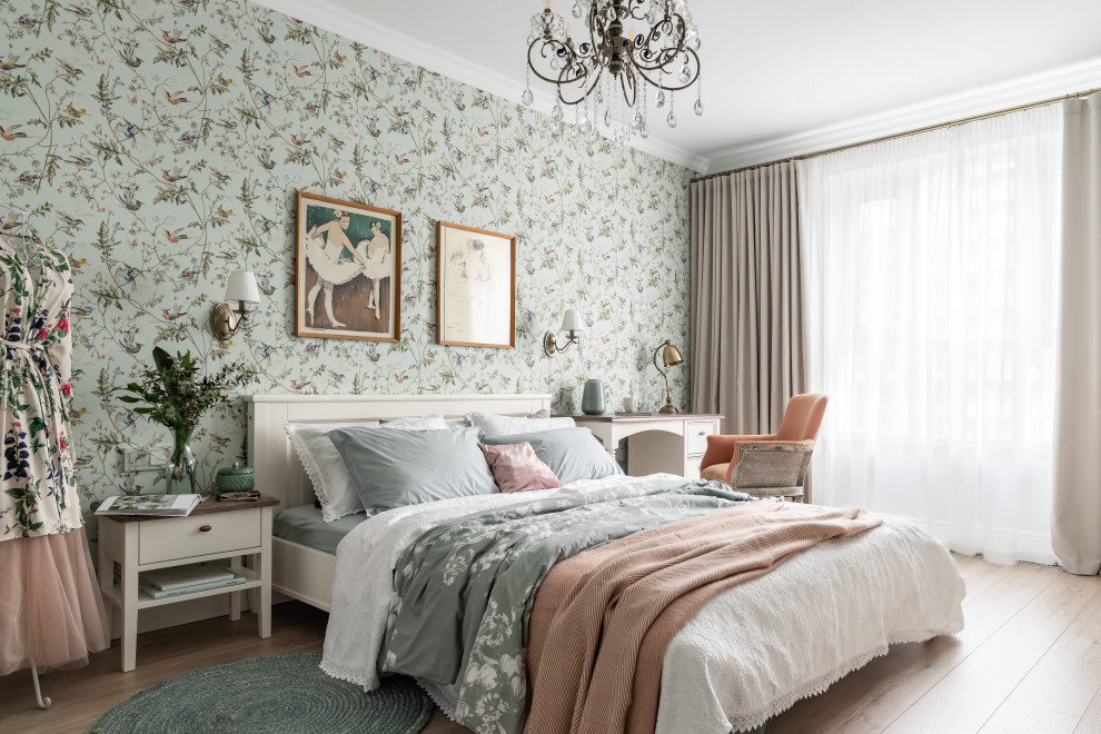 Inspiration for a mid-sized traditional bedroom in London with multi-coloured walls, laminate floors and wallpaper.