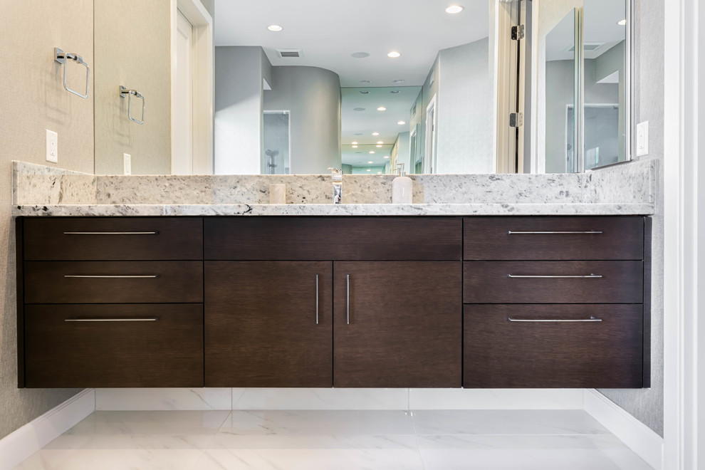 Mid-sized transitional master bathroom in Phoenix with flat-panel cabinets, dark wood cabinets, gray tile, grey walls, marble floors, an undermount sink and marble benchtops.