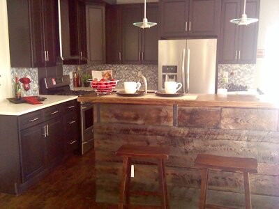 Eat-in kitchen - small eclectic l-shaped dark wood floor and brown floor eat-in kitchen idea in Denver with an undermount sink, flat-panel cabinets, dark wood cabinets, concrete countertops, porcelain backsplash, stainless steel appliances and no island