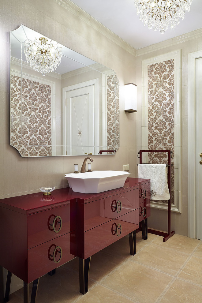 This is an example of a mid-sized traditional powder room in Moscow with flat-panel cabinets, beige tile, ceramic tile, beige walls, ceramic floors, a vessel sink, red cabinets and beige floor.
