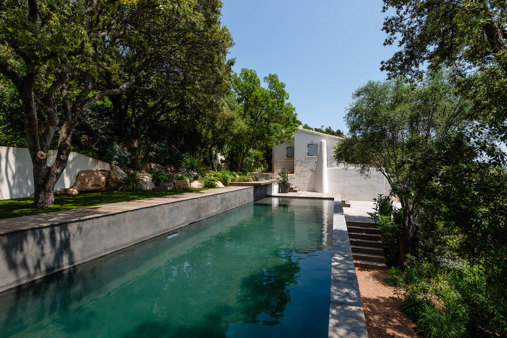 Inspiration for a large contemporary pool in Corsica.