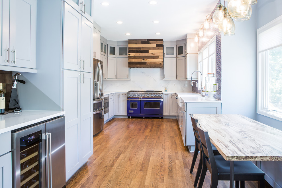 Eat-in kitchen - huge transitional u-shaped eat-in kitchen idea in Denver with shaker cabinets, gray cabinets, quartz countertops, blue backsplash, no island and white countertops