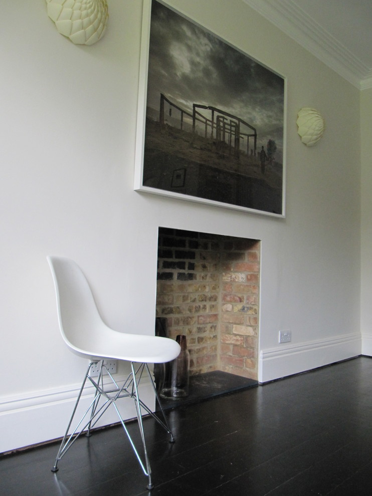 Photo of a mid-sized contemporary open plan dining in Oxfordshire with grey walls and painted wood floors.