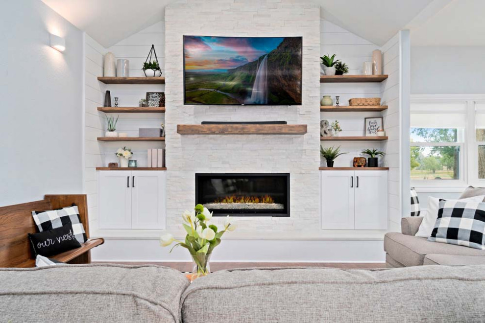 Design ideas for a large contemporary open concept living room in Denver with white walls, medium hardwood floors, a ribbon fireplace, a brick fireplace surround, a built-in media wall, brown floor and vaulted.