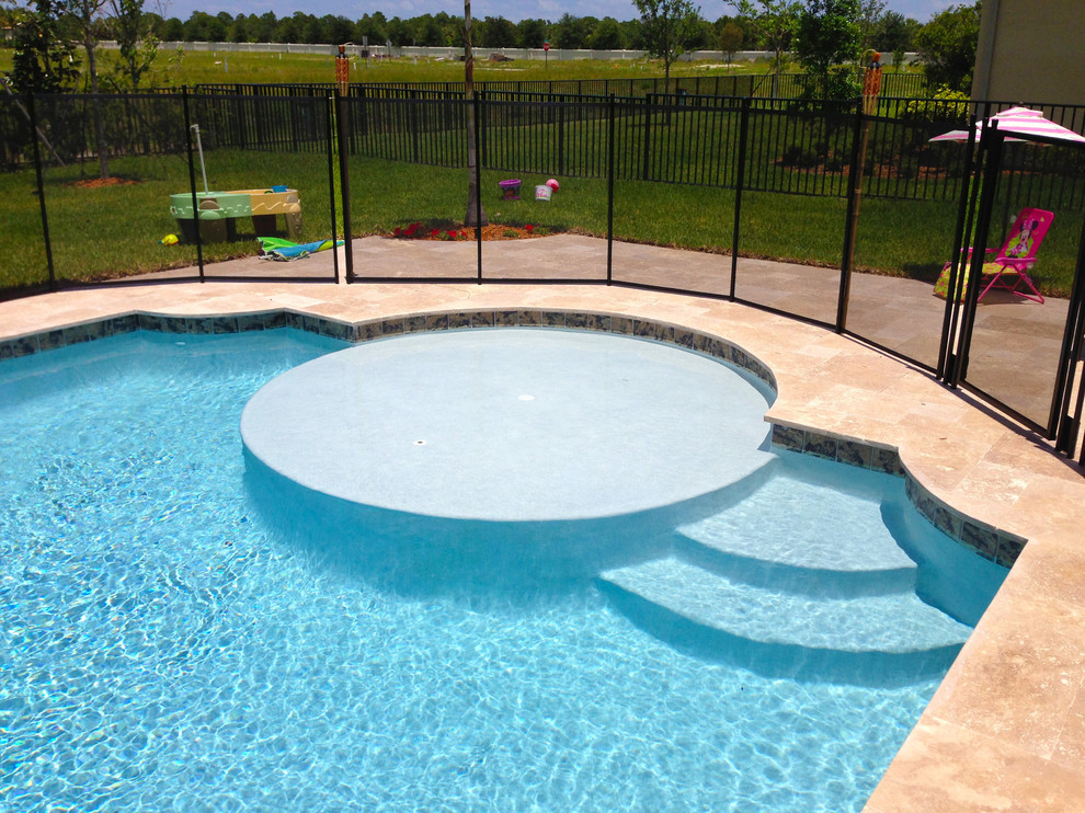 Example of a mid-sized transitional backyard stone and custom-shaped lap pool fountain design in Miami