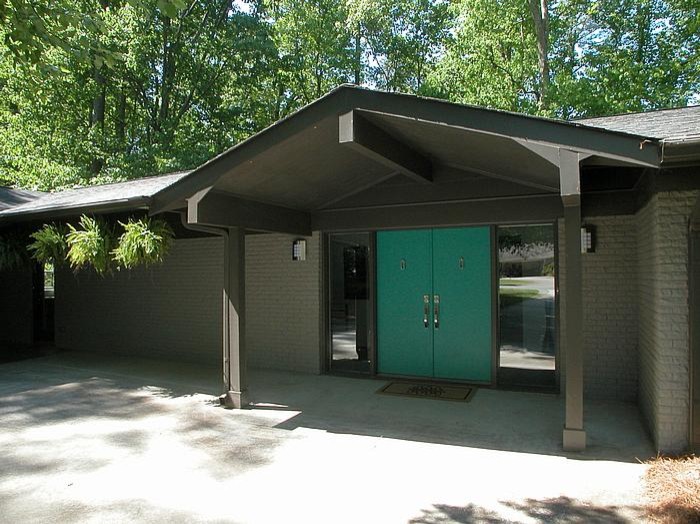 This is an example of a midcentury front door in Atlanta with a double front door and a blue front door.