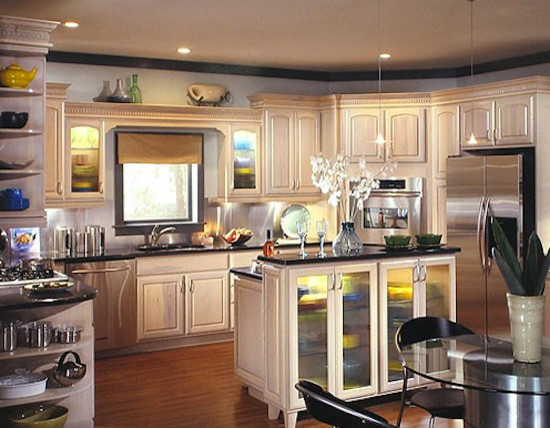 Eat-in kitchen - mid-sized medium tone wood floor eat-in kitchen idea with a drop-in sink, distressed cabinets, granite countertops, beige backsplash and stainless steel appliances