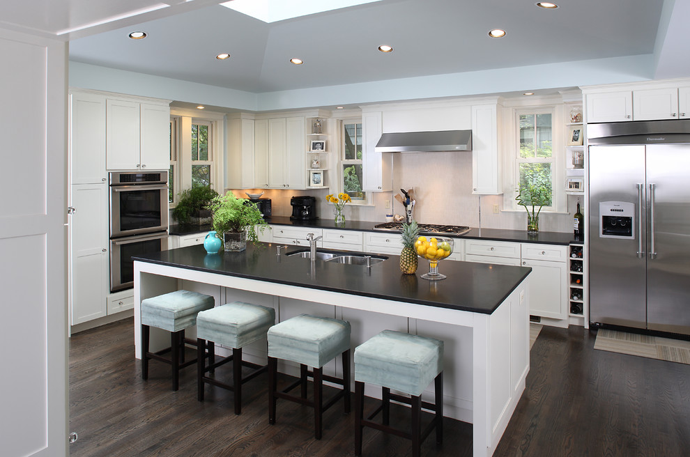 This is an example of a transitional kitchen in DC Metro with stainless steel appliances.