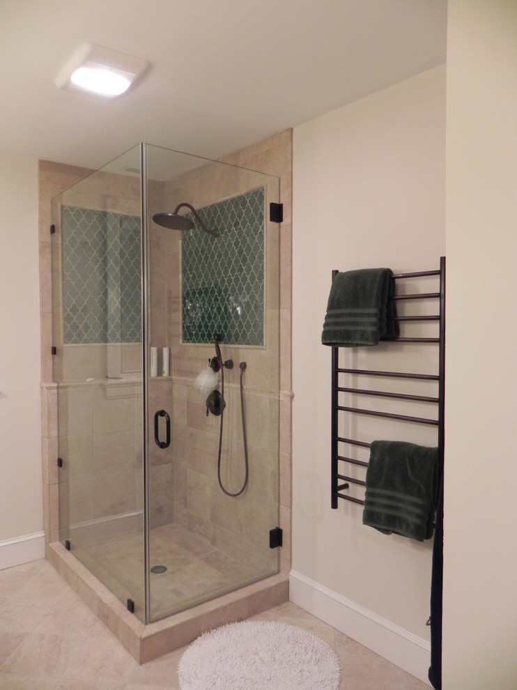 This is an example of a transitional bathroom in Raleigh with a corner shower, beige tile, ceramic tile, beige walls and ceramic floors.