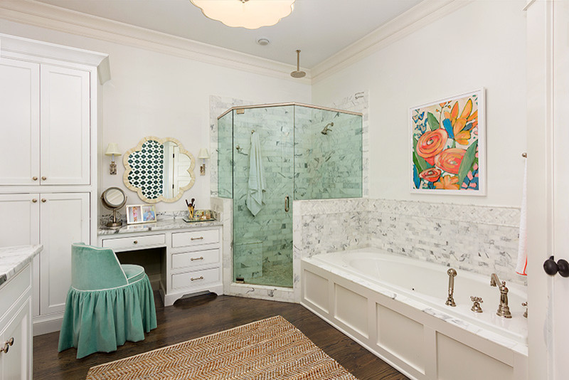 Inspiration for a large transitional master bathroom in Atlanta with shaker cabinets, white cabinets, a drop-in tub, a corner shower, gray tile, white tile, stone tile, white walls, dark hardwood floors, marble benchtops, brown floor and a hinged shower door.