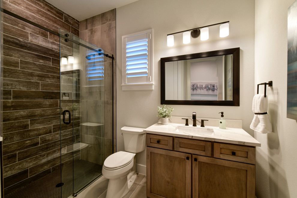 Inspiration for a mid-sized transitional brown floor, single-sink and tray ceiling bathroom remodel with shaker cabinets, medium tone wood cabinets, gray walls, quartz countertops and a freestanding vanity