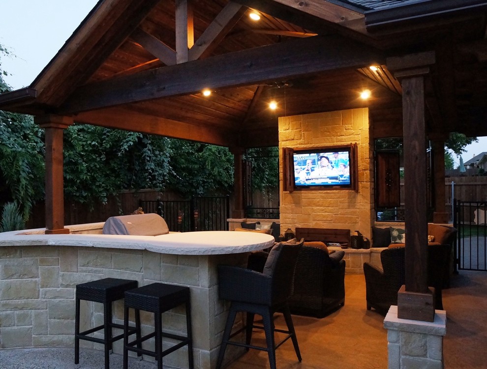 Design ideas for a large traditional backyard patio in Dallas with an outdoor kitchen and a gazebo/cabana.