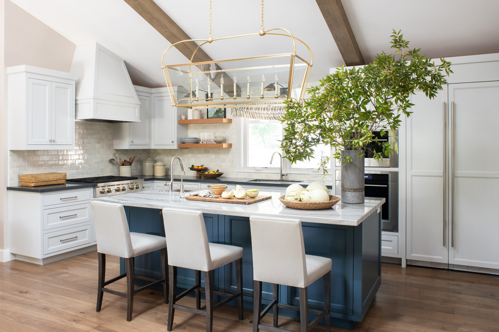 Design ideas for a transitional kitchen in San Francisco with blue cabinets, medium hardwood floors, with island and vaulted.