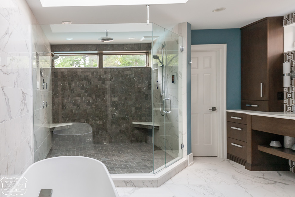 Freestanding bathtub - large transitional master brown tile and ceramic tile porcelain tile and white floor freestanding bathtub idea with flat-panel cabinets, brown cabinets, a bidet, blue walls, an undermount sink, wood countertops, a hinged shower door and brown countertops