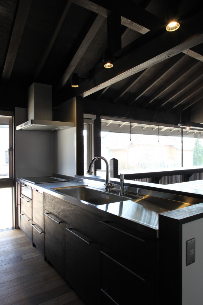 Photo of a country kitchen in Other with stainless steel benchtops and purple benchtop.
