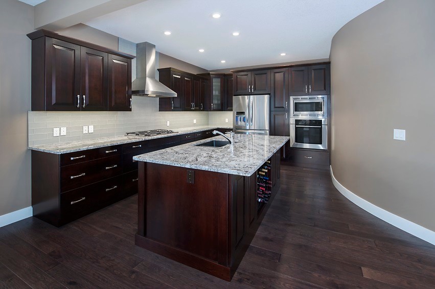 Example of a transitional kitchen design in Calgary