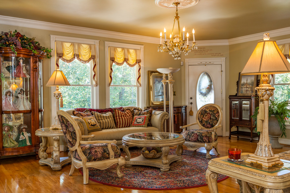 Photo of a traditional formal enclosed living room in Other with beige walls, medium hardwood floors and orange floor.