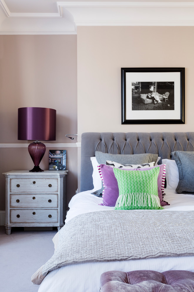 Design ideas for a transitional bedroom in London with grey walls and carpet.