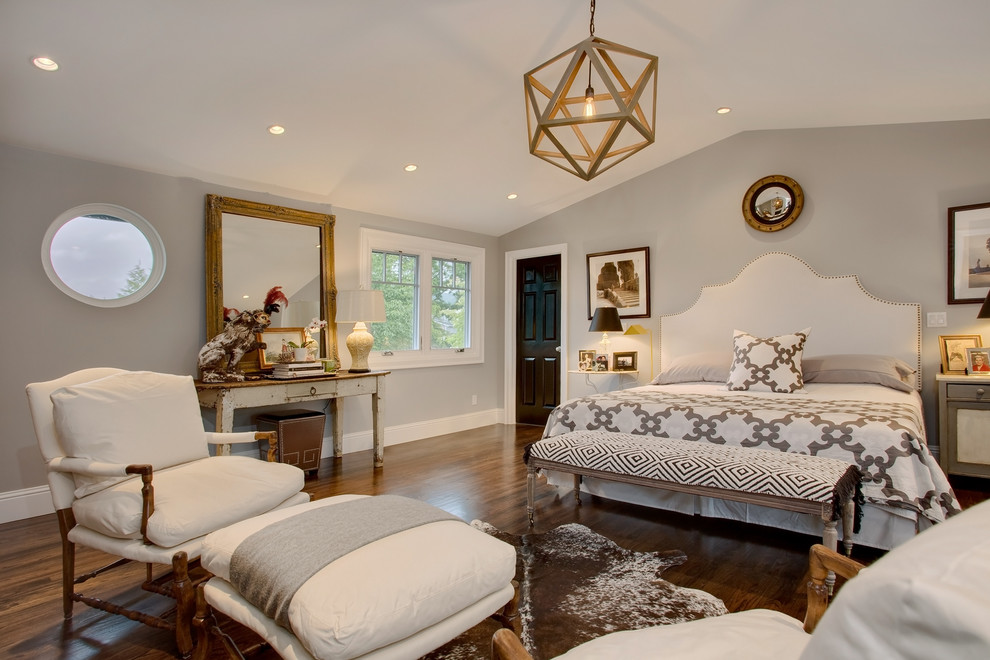 Transitional master bedroom in Seattle with grey walls and dark hardwood floors.