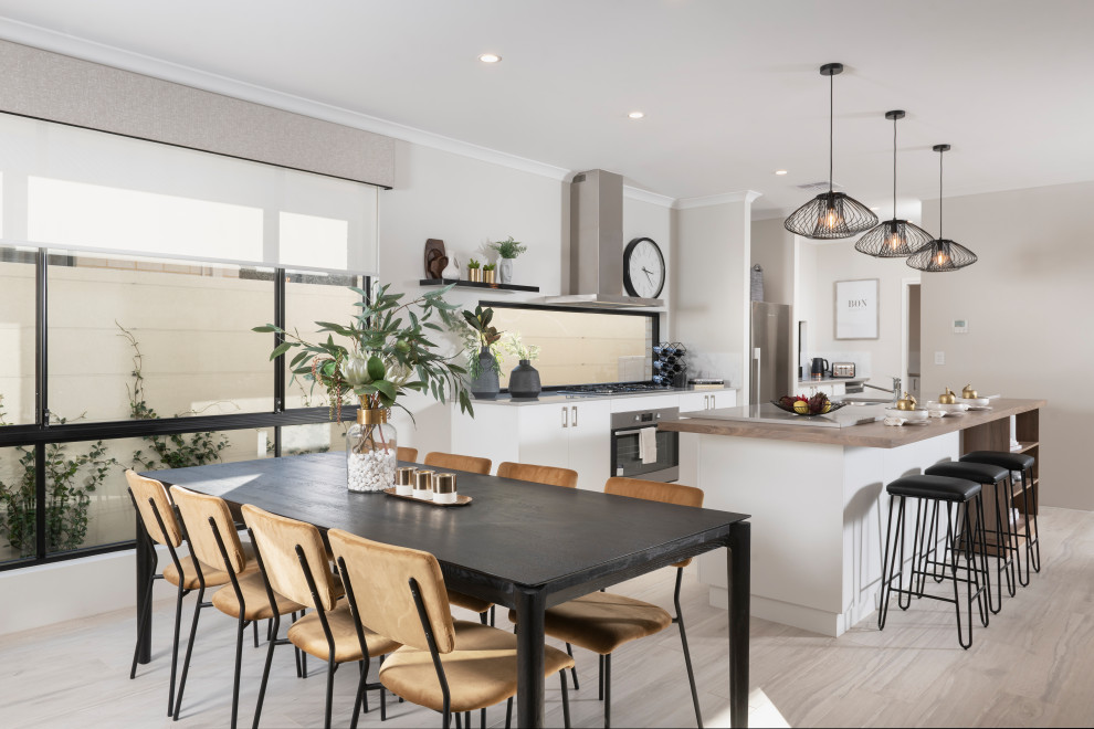 Mid-sized contemporary kitchen/dining combo in Perth with grey walls and beige floor.