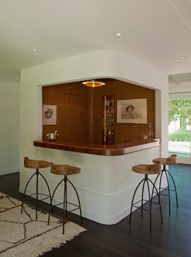 Inspiration for a mid-sized midcentury l-shaped seated home bar in Los Angeles with copper benchtops, dark hardwood floors and brown floor.