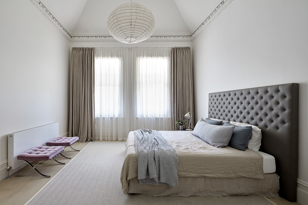 Design ideas for a contemporary master bedroom in Melbourne with white walls, light hardwood floors and beige floor.