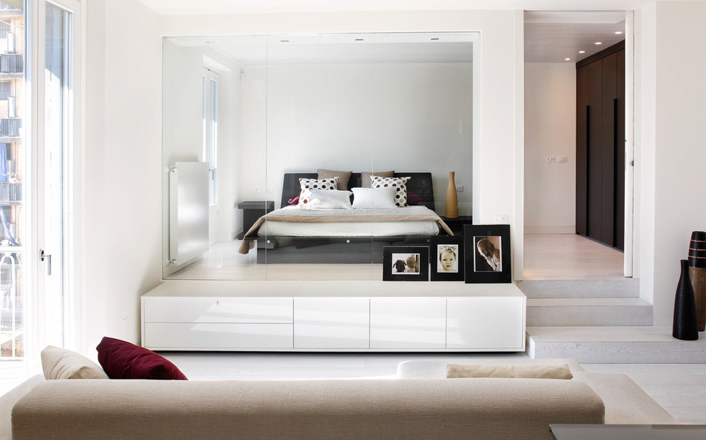 Inspiration for a contemporary master bedroom in Milan with white walls.