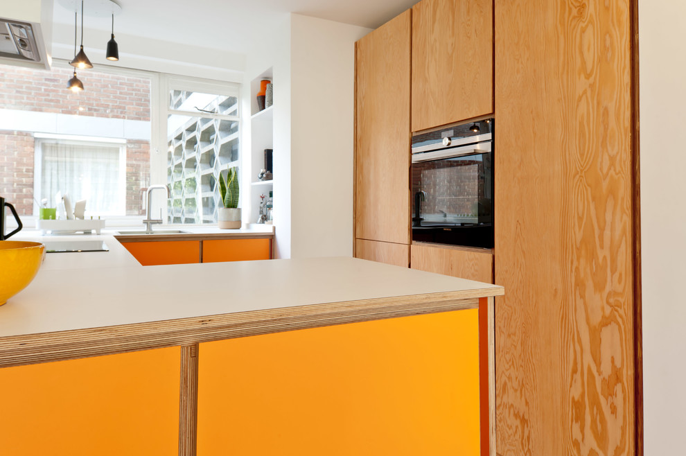 Photo of a contemporary separate kitchen in London.