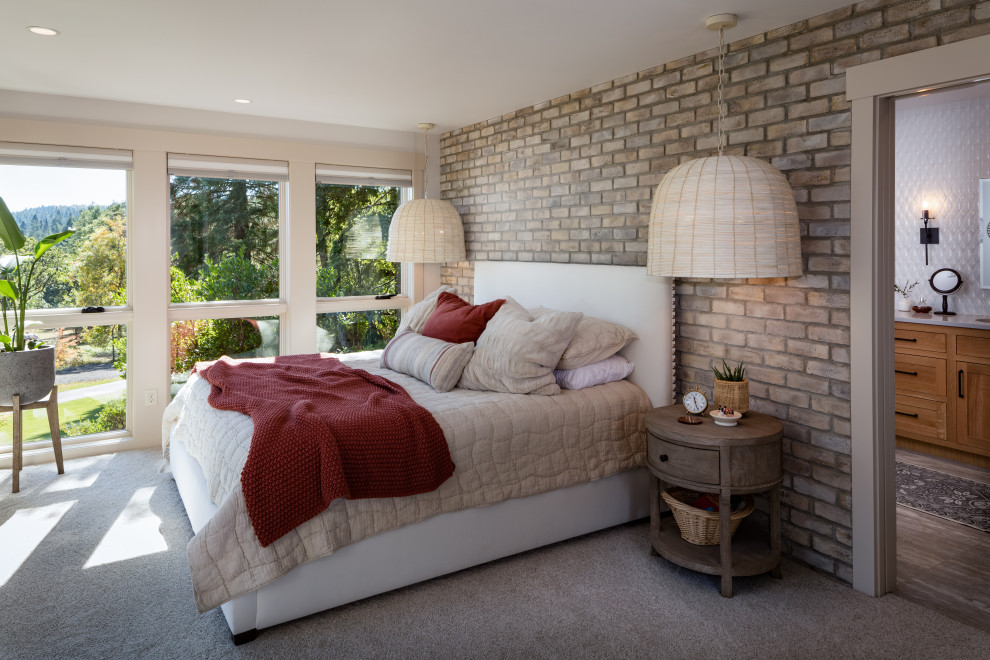 Mid-sized contemporary bedroom in Other with carpet and brick walls.