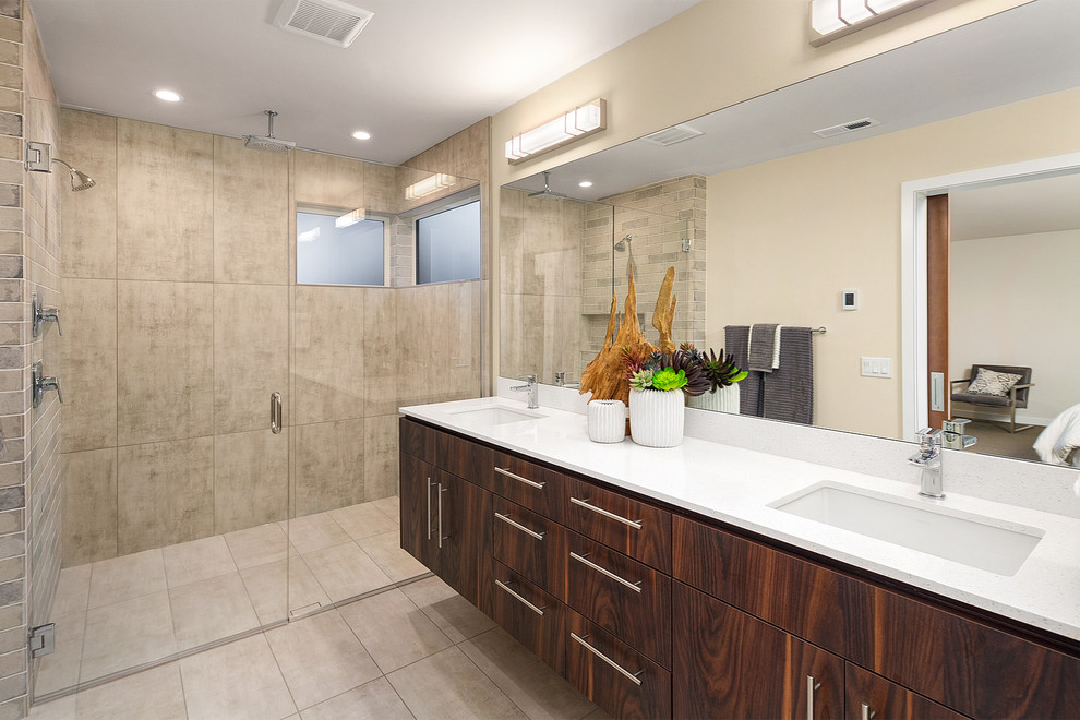 Photo of a contemporary bathroom in Seattle with flat-panel cabinets, dark wood cabinets, gray tile, beige walls, an undermount sink, grey floor and white benchtops.