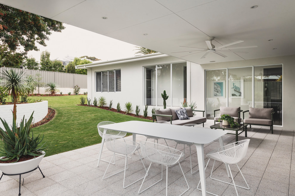 Inspiration for a contemporary backyard patio in Perth with concrete pavers and a roof extension.