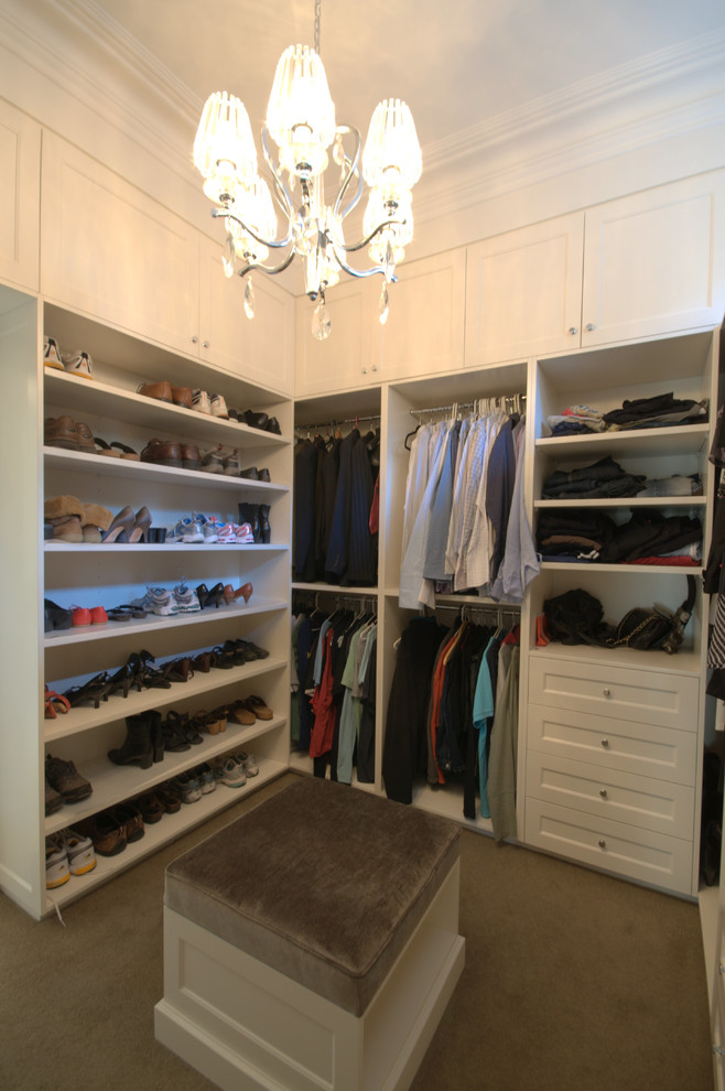 Photo of a large traditional gender-neutral walk-in wardrobe in Melbourne with shaker cabinets, carpet, white cabinets and beige floor.