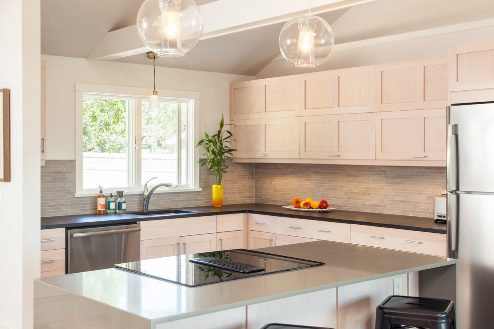 Photo of a mid-sized contemporary l-shaped open plan kitchen in Boston with an undermount sink, shaker cabinets, grey cabinets, recycled glass benchtops, grey splashback, matchstick tile splashback, stainless steel appliances and with island.